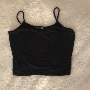 Black top with spaghetti straps size L stretches.